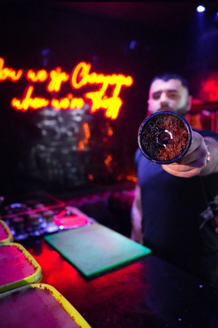 Hookah with neon signage at Medusa Lounge