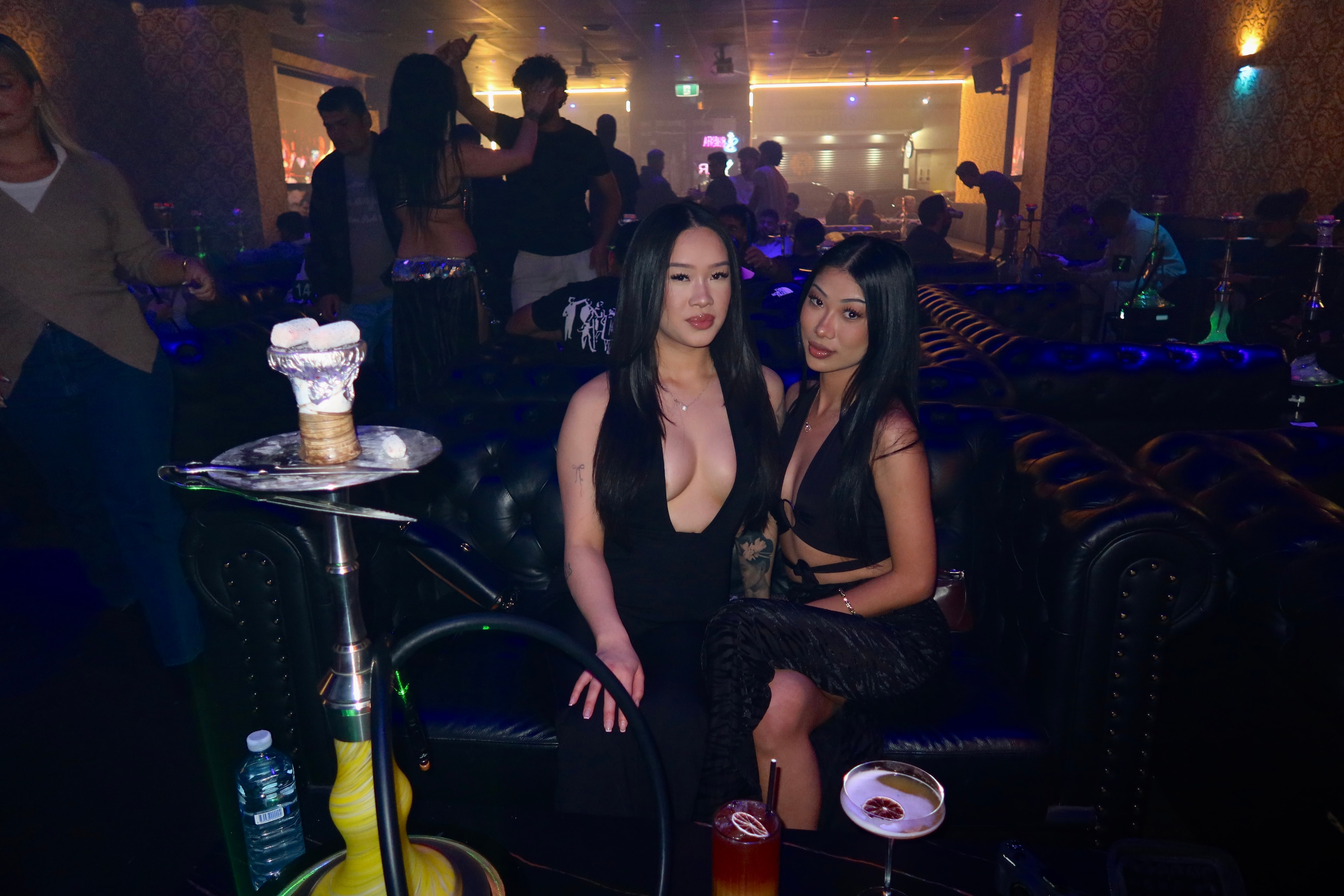 Guests enjoying hookah and cocktails at Medusa Lounge