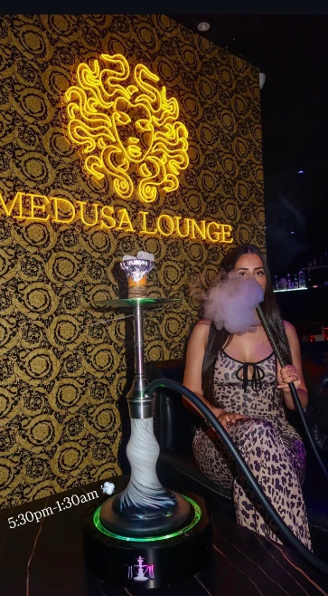 Medusa Lounge neon sign with hookah